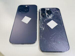 背面ガラスが激しく割れたiPhone14ProMaxと修理後に綺麗に復旧した状態の比較（ララガーデン川口での背面修理）